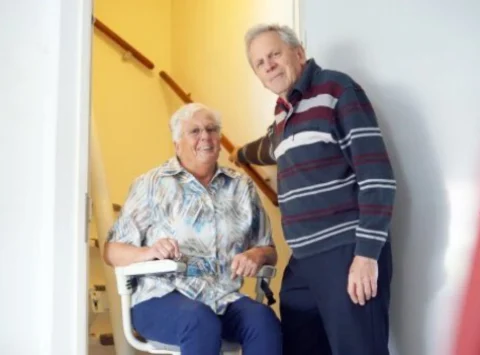 stairlift installation Mississauga senior woman on chair lift indoors