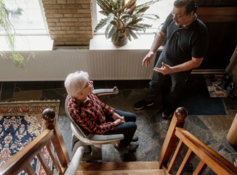 Customer From Summit Stairlifts On A Straight Stairlift With Mechanic - stairlift mississauga