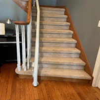 Stairlift Rail Along The Inside Of A Curve In Ontario, Canada