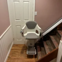 Straight Stairlift In Front Of A White Door